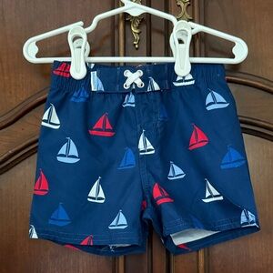 RUGGED BUTTS Nautical Swim Trunks - Blue with Red and White Sailboats 12-18M NWT